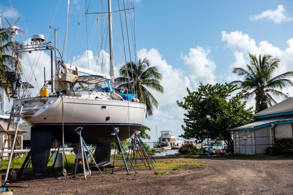A sailboat for sale on a boatyard in the caribbean. 
