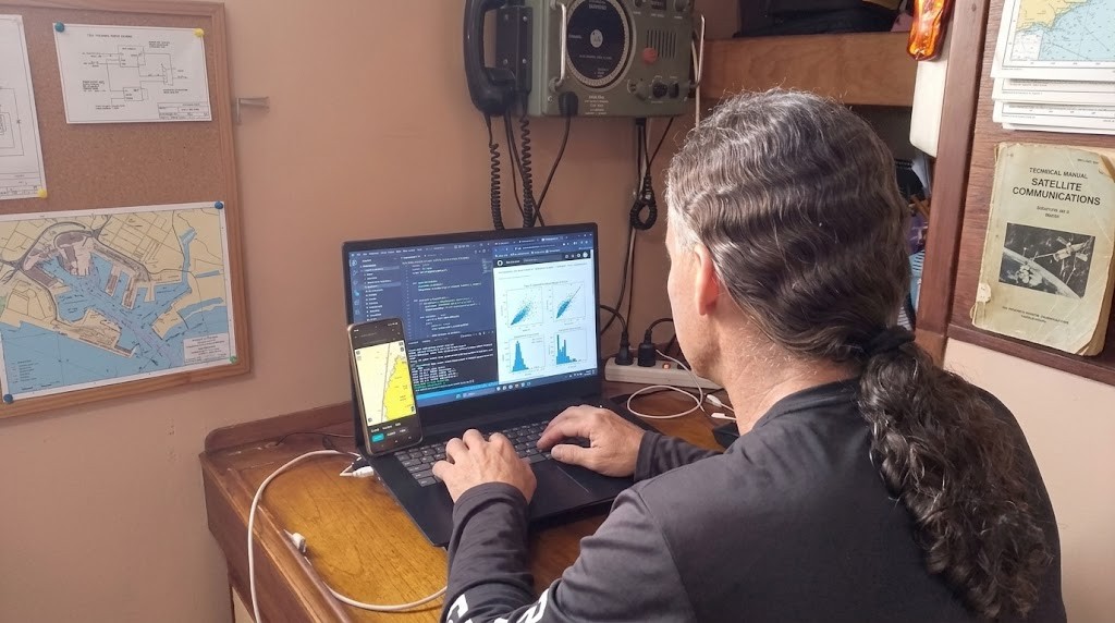 Ramon working remotely from aboard Mutiny while living on a sailboat in the Caribbean.