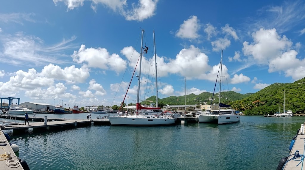 Riggers climbing the mast in the Caribbean.
