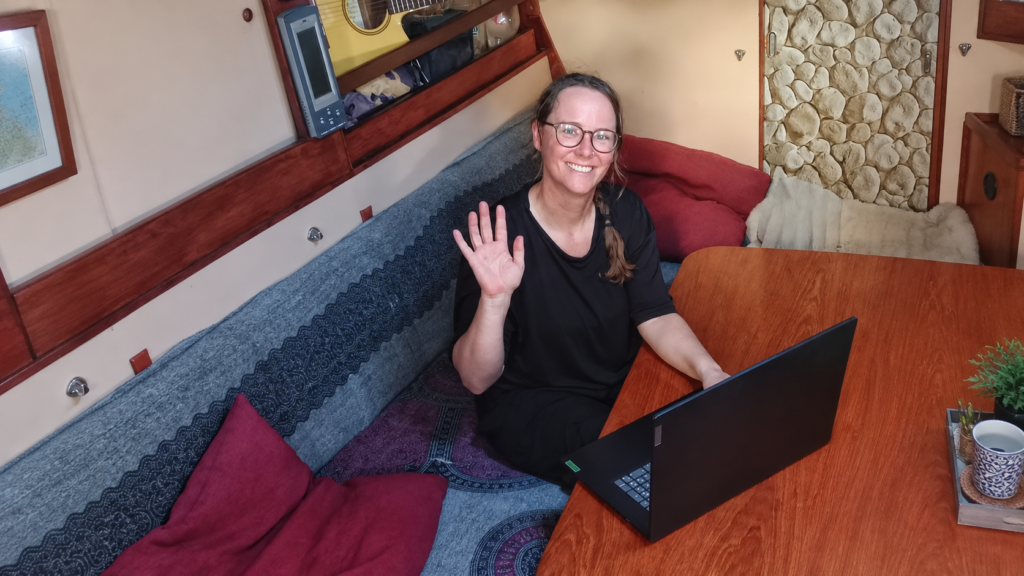 Lotte working in the saloon of our liveaboard sailboat.